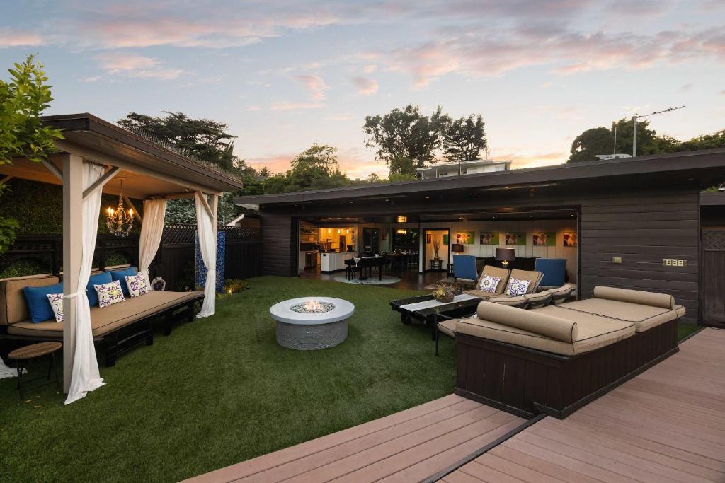 an outdoor patio with couches and a fire pit at New Listing Burbank Bungalow by Colby&Conrad in Los Angeles