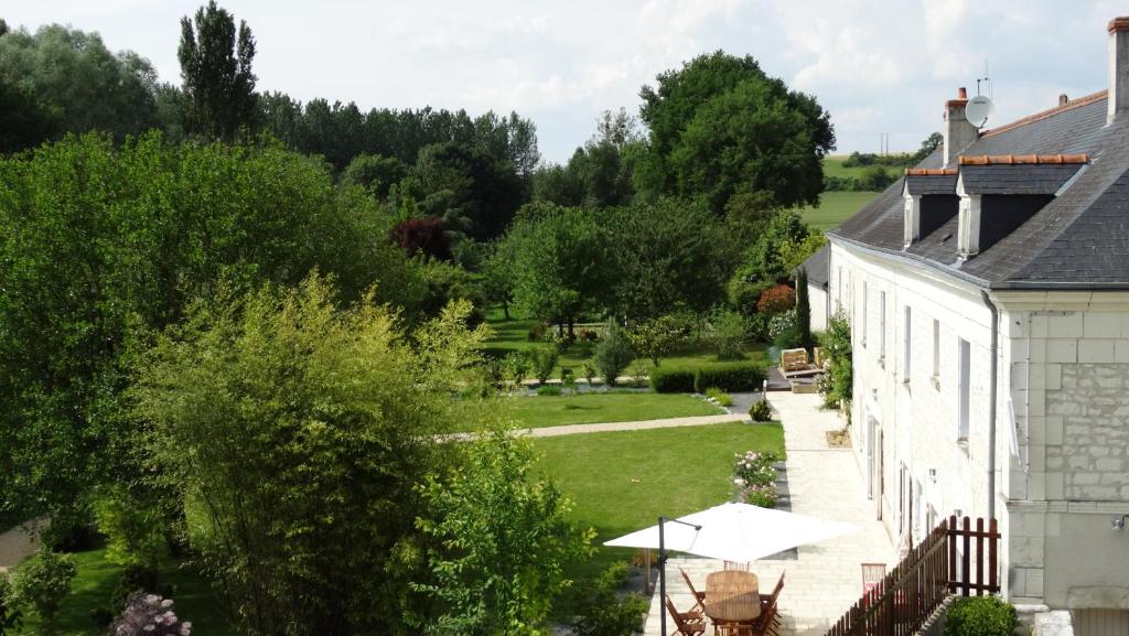 a view of the garden from the house at Moulin de reigner in Anché
