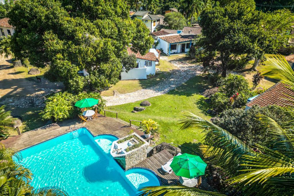 an aerial view of a house with a swimming pool at VELINN Pousada Bromelias in Ilhabela