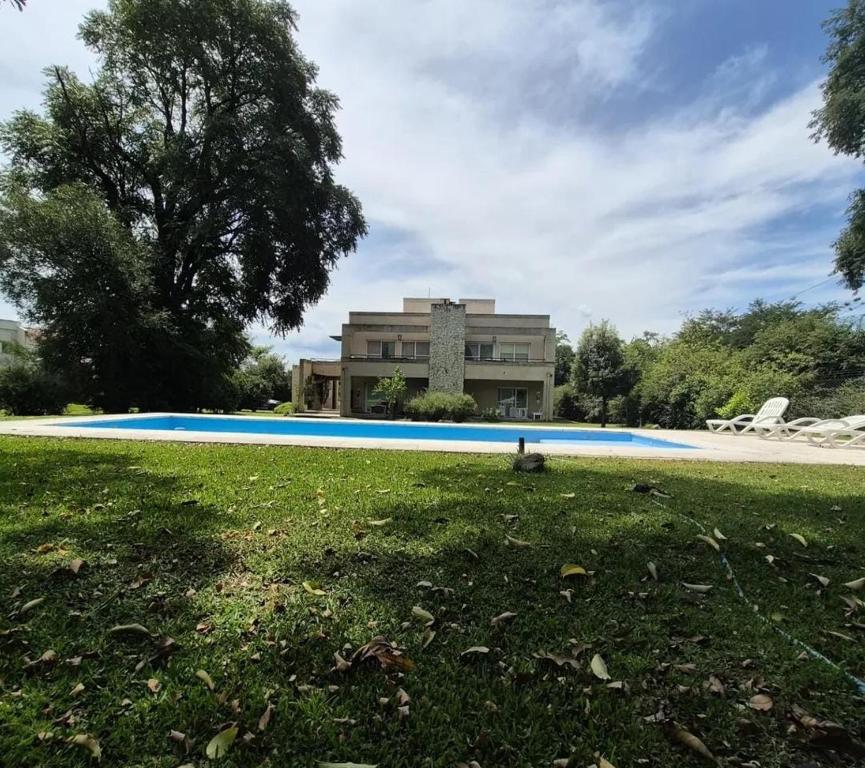 a large swimming pool in front of a building at Apart Boutique Macedonia in San Lorenzo