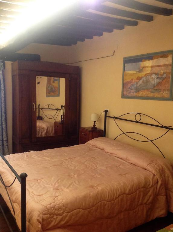 Postel nebo postele na pokoji v ubytování Agriturismo I Sassi Grossi