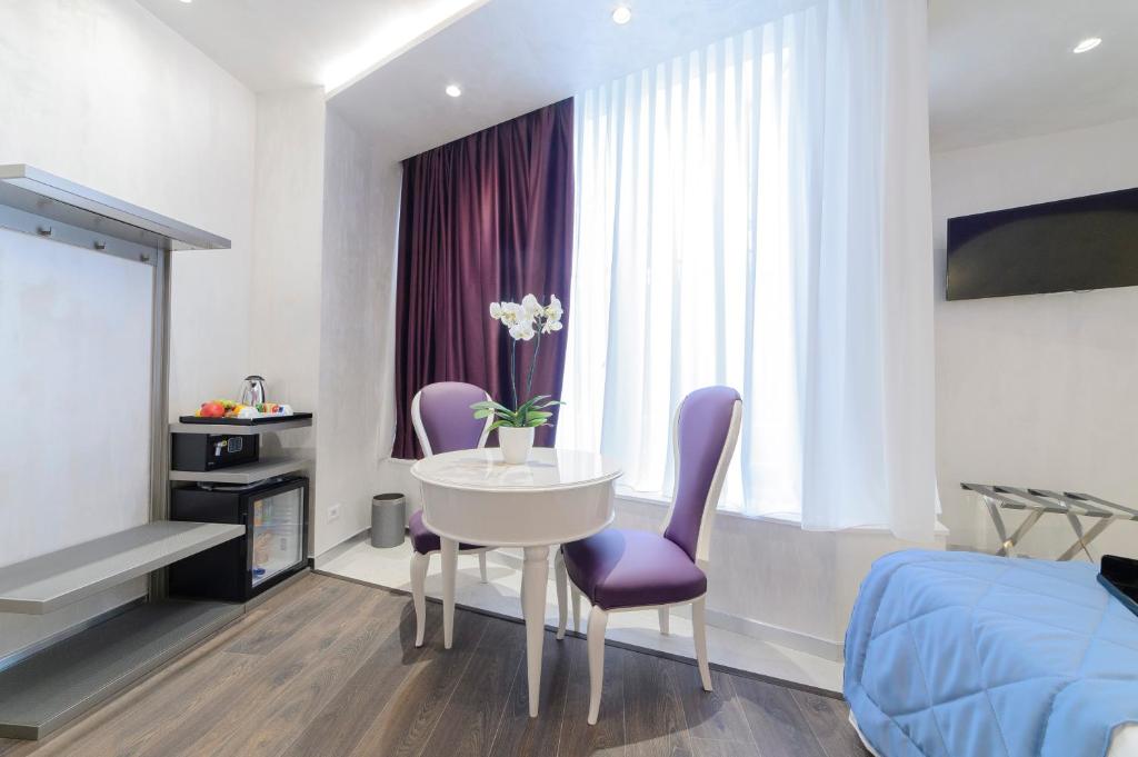 TV a/nebo společenská místnost v ubytování Hotel Vespasiano