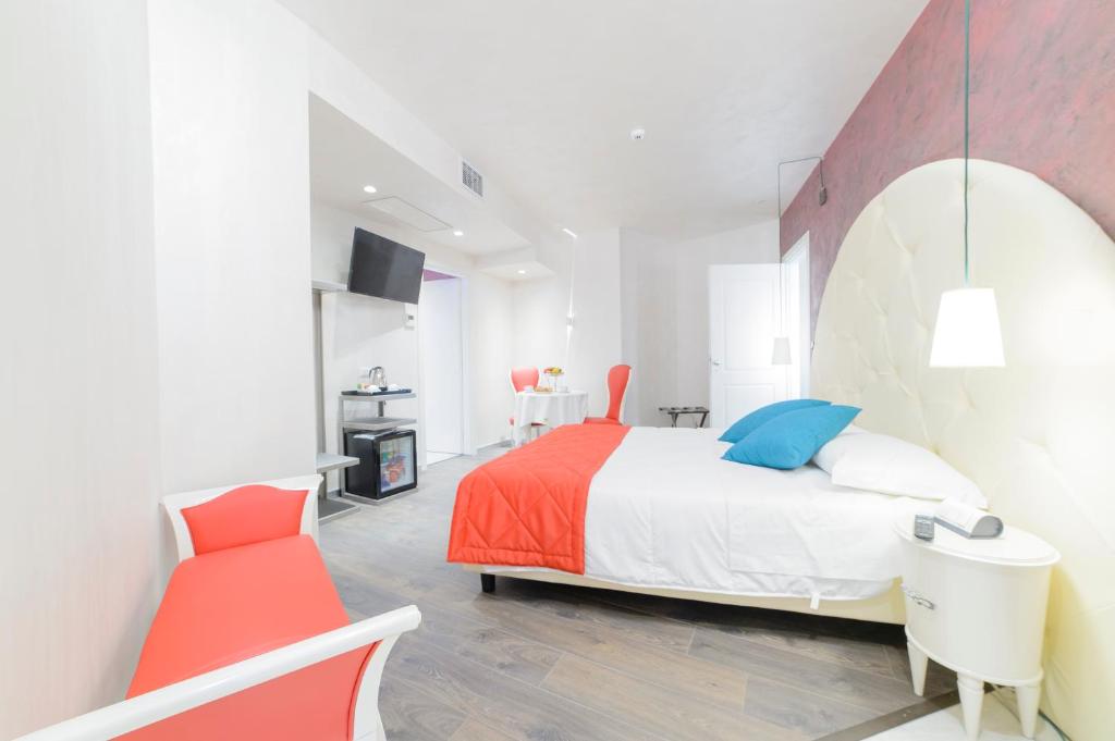 Postel nebo postele na pokoji v ubytování Hotel Vespasiano
