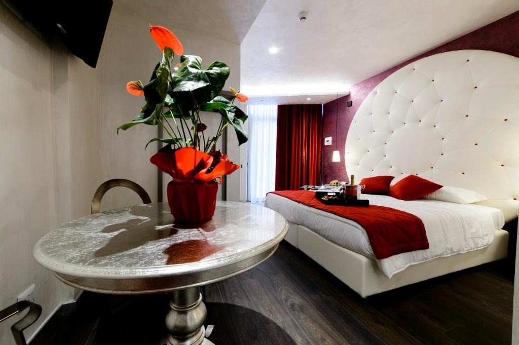 Cama ou camas em um quarto em Hotel Vespasiano