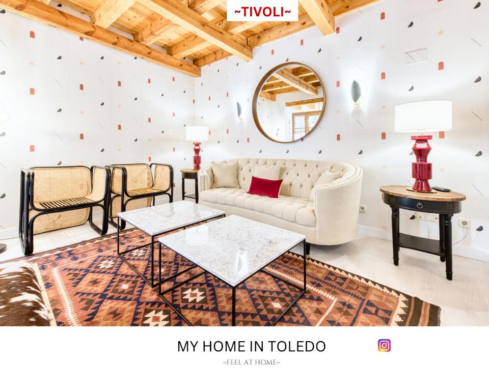 a living room with a couch and a table at -TÍVOLI- by myhomeintoledo in Toledo