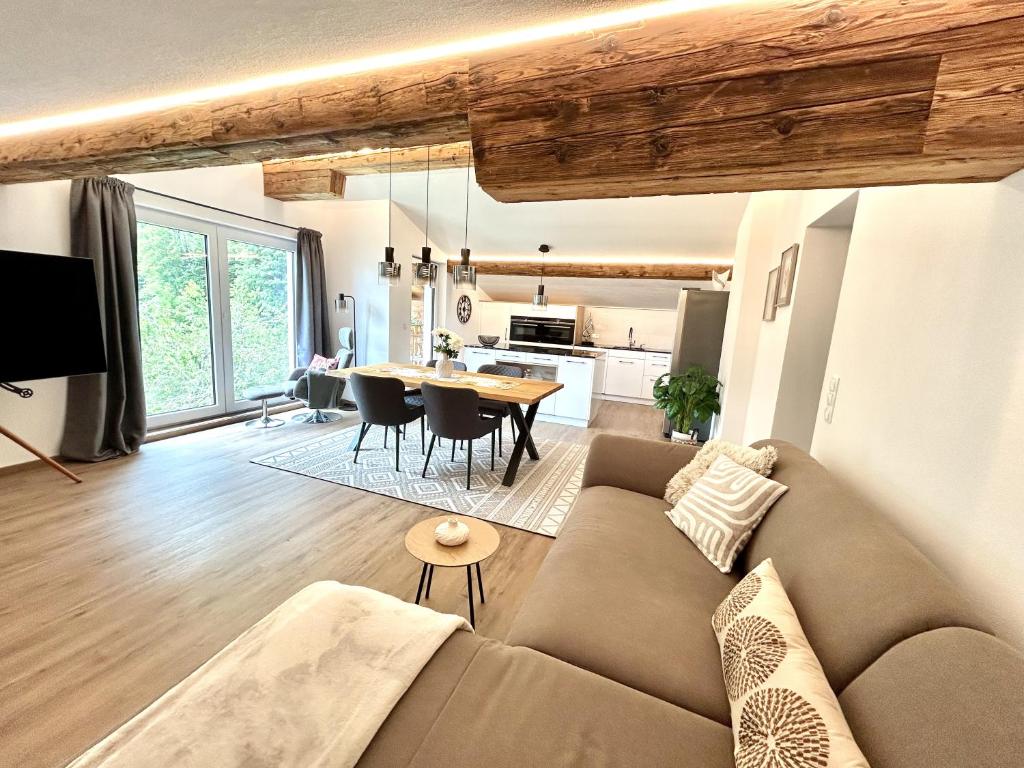 a living room with a couch and a table at Haus Susanne in Bürserberg