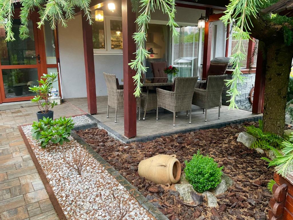 a patio with chairs and a table on a house at Charming home near old town in Košice