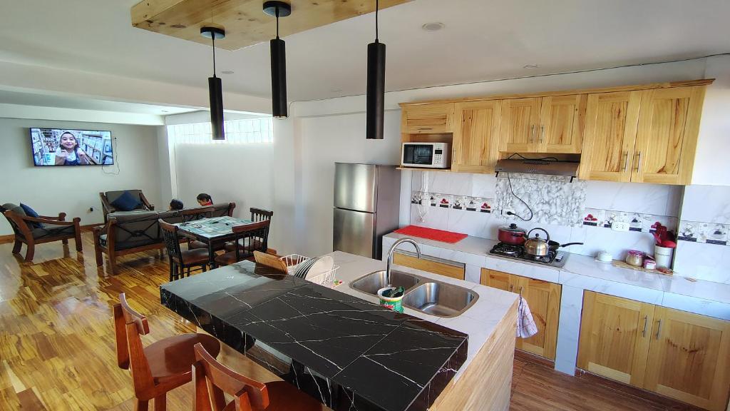 a kitchen with a sink and a counter top at The Hannah's house 2 in Cusco