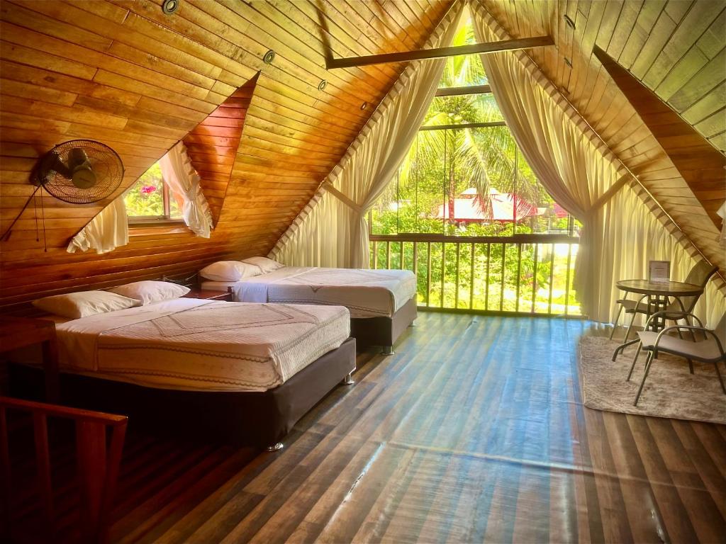 Ένα ή περισσότερα κρεβάτια σε δωμάτιο στο Green Paradise Bungalows