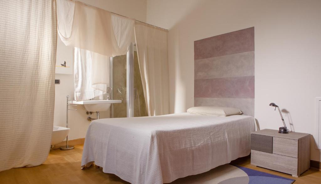 Postel nebo postele na pokoji v ubytování A Casa