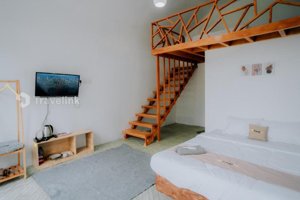 Katil atau katil-katil dalam bilik di Flamboyan Cabin By Travelink