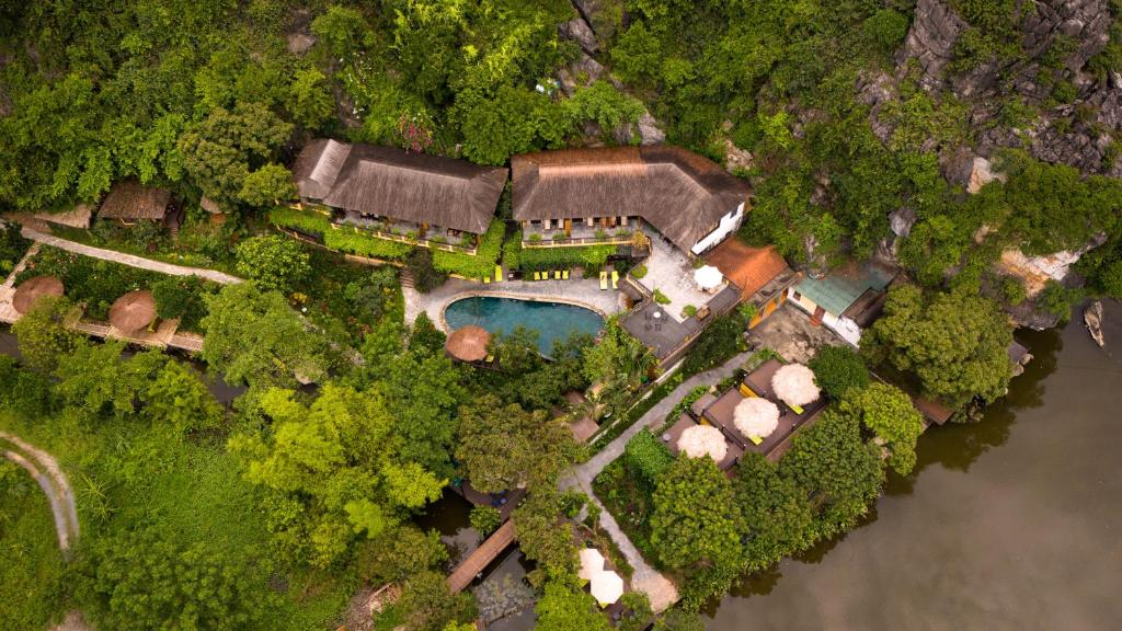 an aerial view of a house with a swimming pool at Trang An Ecolodge in Ninh Binh