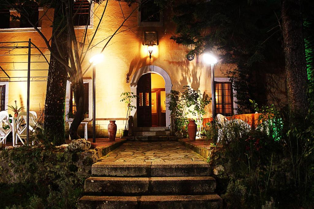 a house with stairs leading to the front door at night at Villa La Cucullera in Catanzaro