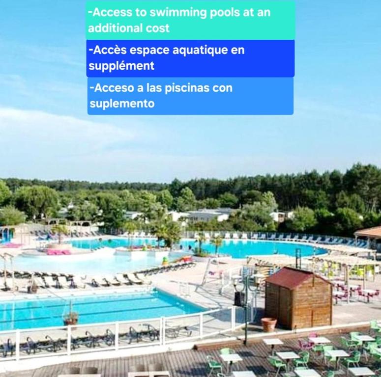 access to swimming pools at an additional cost access to swimming pools at an additional cost at Mobil-home 4chambres-10 couchages - Parking gratuit - 2 accès piscines inclus dès 3 nuitées in Gastes