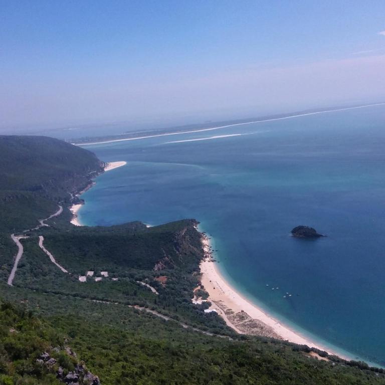 an aerial view of a beach and the ocean at Ha Mar ao Luar in Setúbal