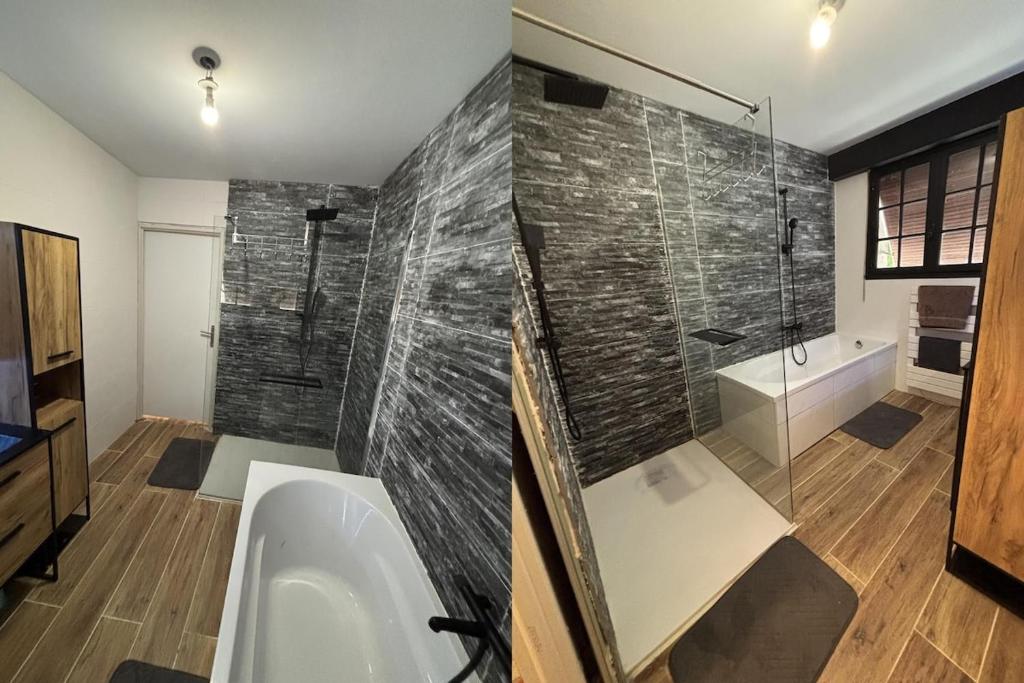 a bathroom with a shower and a tub and a sink at Villa Perle Atlantique in La Vallée