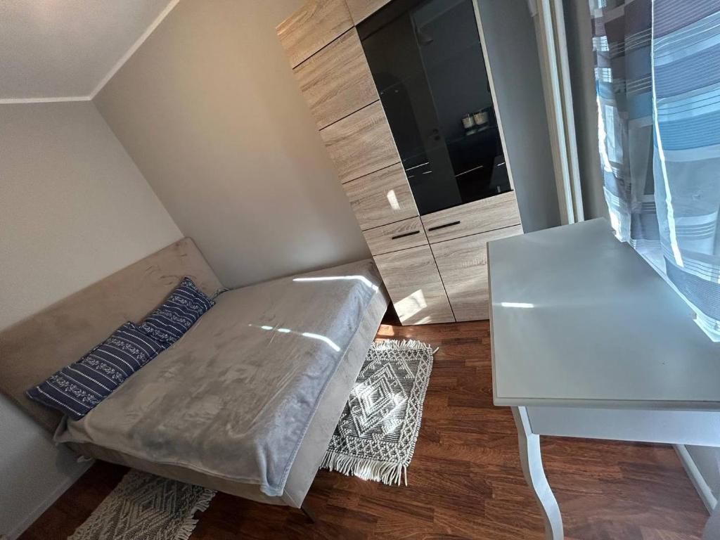 a small room with a couch and a table at Berlin Wohnung komfort in Berlin