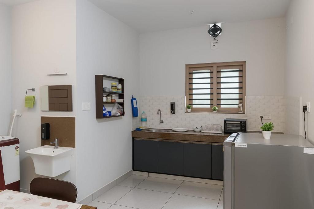 Kuchyň nebo kuchyňský kout v ubytování Entire 2 Bhk Apartment