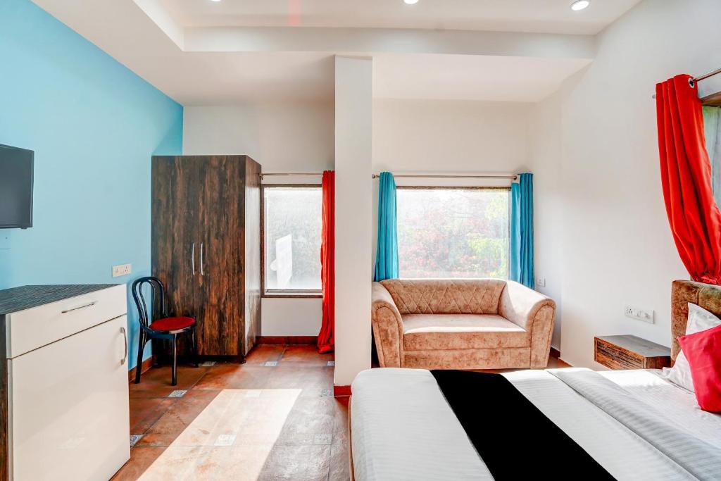 Postel nebo postele na pokoji v ubytování Hotel O Mannat