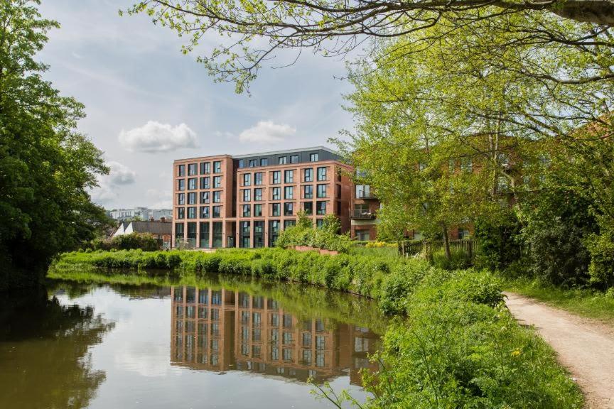 a building on the side of a river at Riverside House at Guildford in Guildford