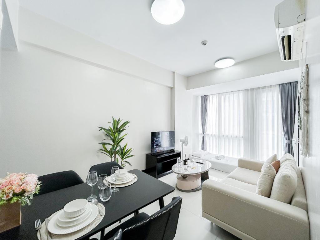 a living room with a couch and a table at OPR Standard 1BR #4 in Lapu Lapu City