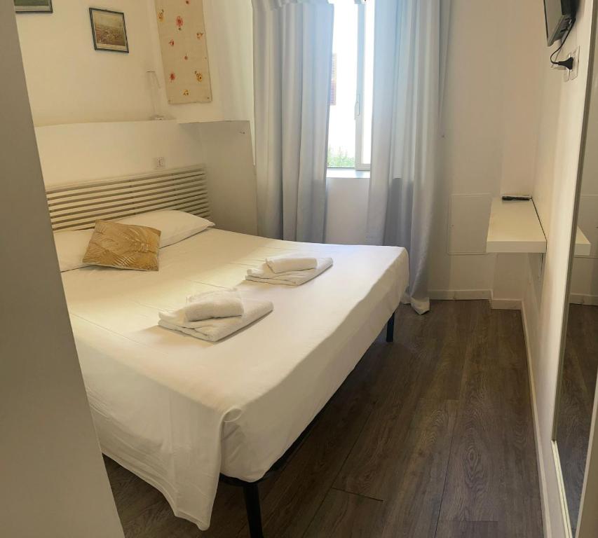 Postel nebo postele na pokoji v ubytování Vaticano San Pietro metro ottaviano