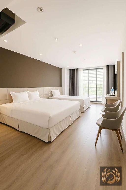 Giường trong phòng chung tại Kim Thanh Boutique Hotel Nha Trang