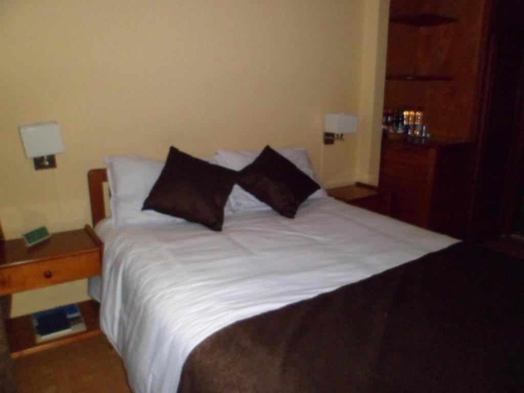 Postel nebo postele na pokoji v ubytování Hotel Tuvalu