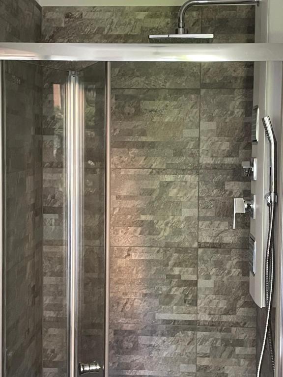 a shower with a glass door in a bathroom at Il Sogno di Giorgio in Chiavari