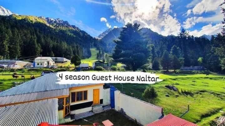 a guest house with a view of a mountain at 4 Season Guest House Naltar in Gilgit