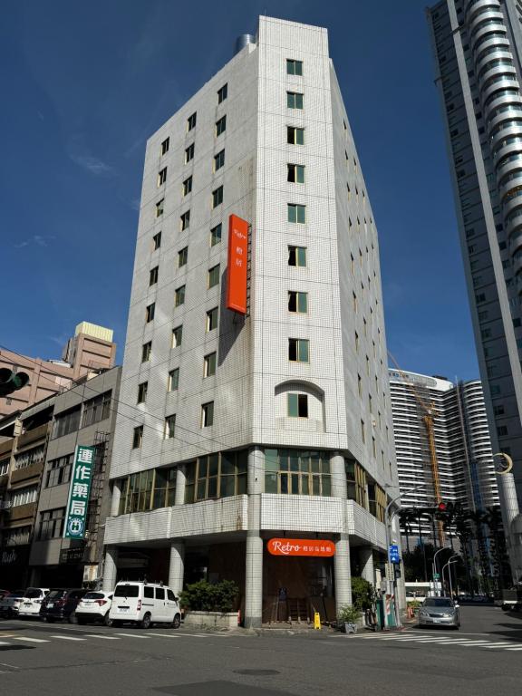a tall building with a sign on the side of it at Retro Kaohsiung in Kaohsiung