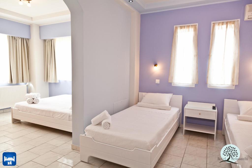 Postel nebo postele na pokoji v ubytování Hotel Melissanthi