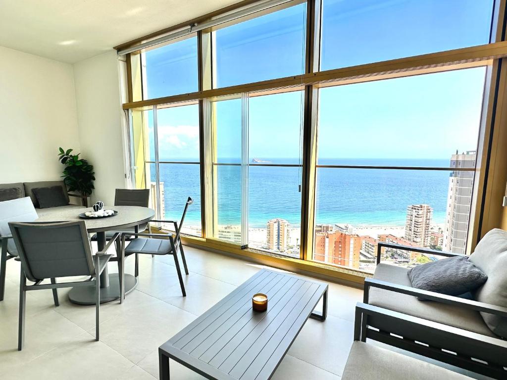 a living room with a view of the ocean at Intempo by Holuxe - 176 - 17th floor in Benidorm