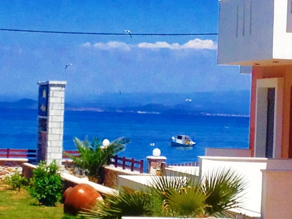 a view of the ocean from a balcony of a building at Nitelli's Houses in Skála Néon Kydonión