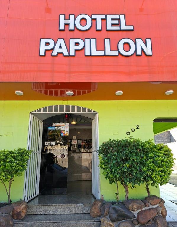 a hotel pavilion sign on the side of a building at papillon hotel in São Paulo