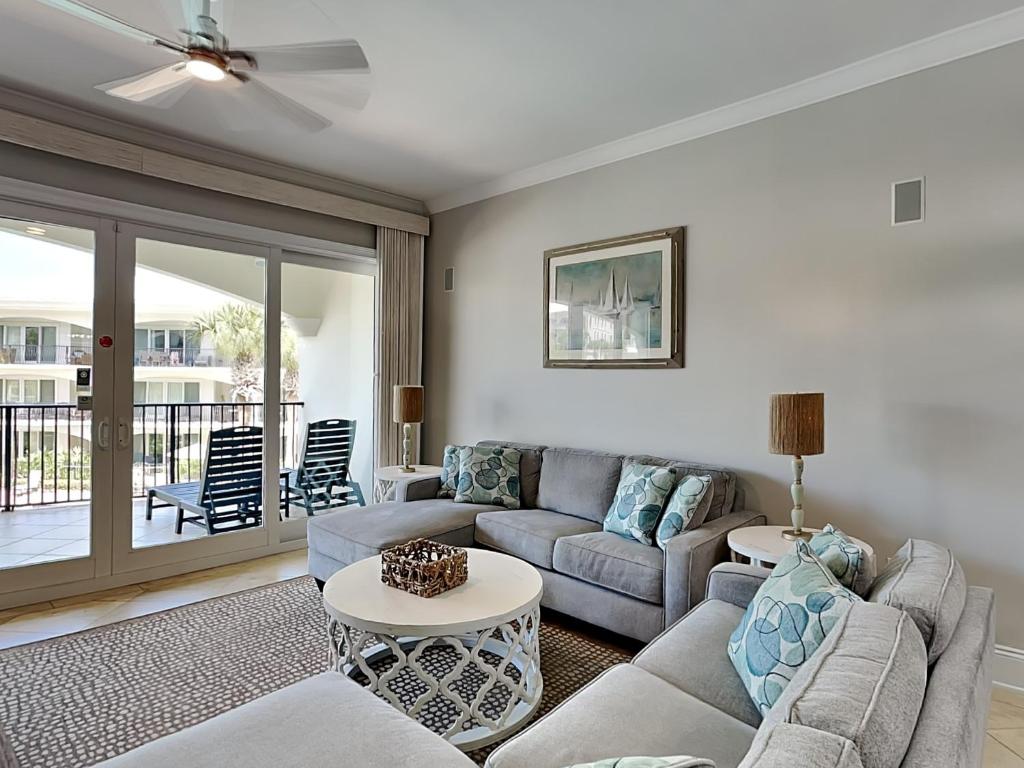 a living room with a couch and a table at Adagio #203E in Santa Rosa Beach