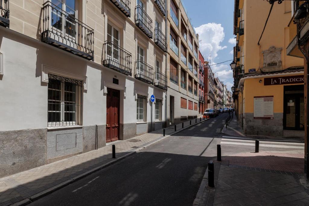 an empty street in a city with buildings at Fomento by Wynwood House in Madrid