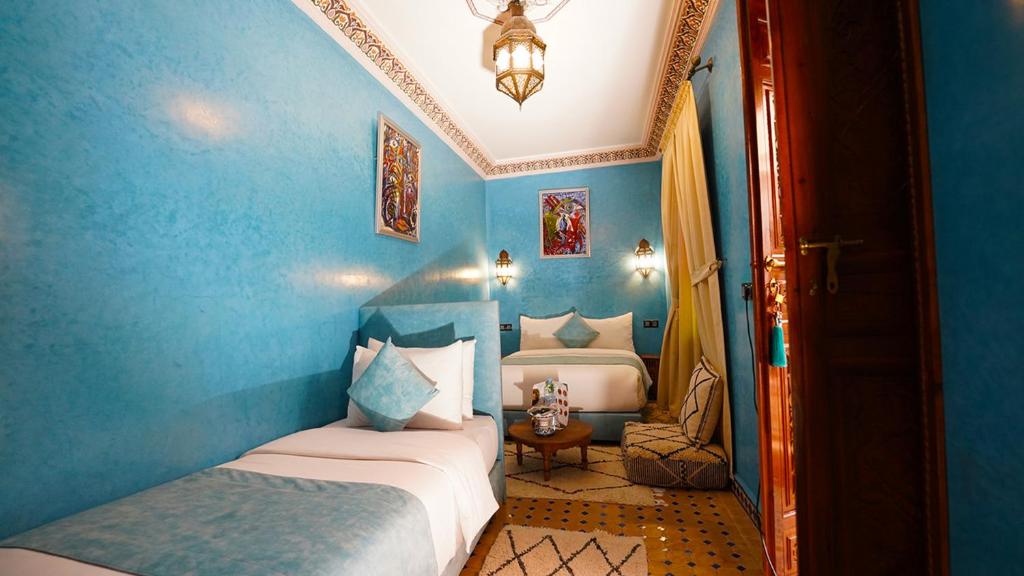 Postel nebo postele na pokoji v ubytování Riad Touhfa Kasbah Marrakech