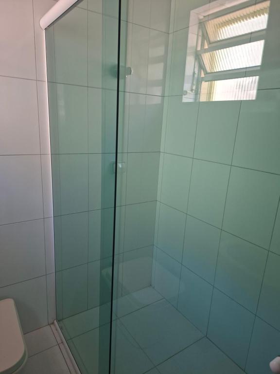 a shower with a glass door in a bathroom at papillon hotel in Sao Paulo