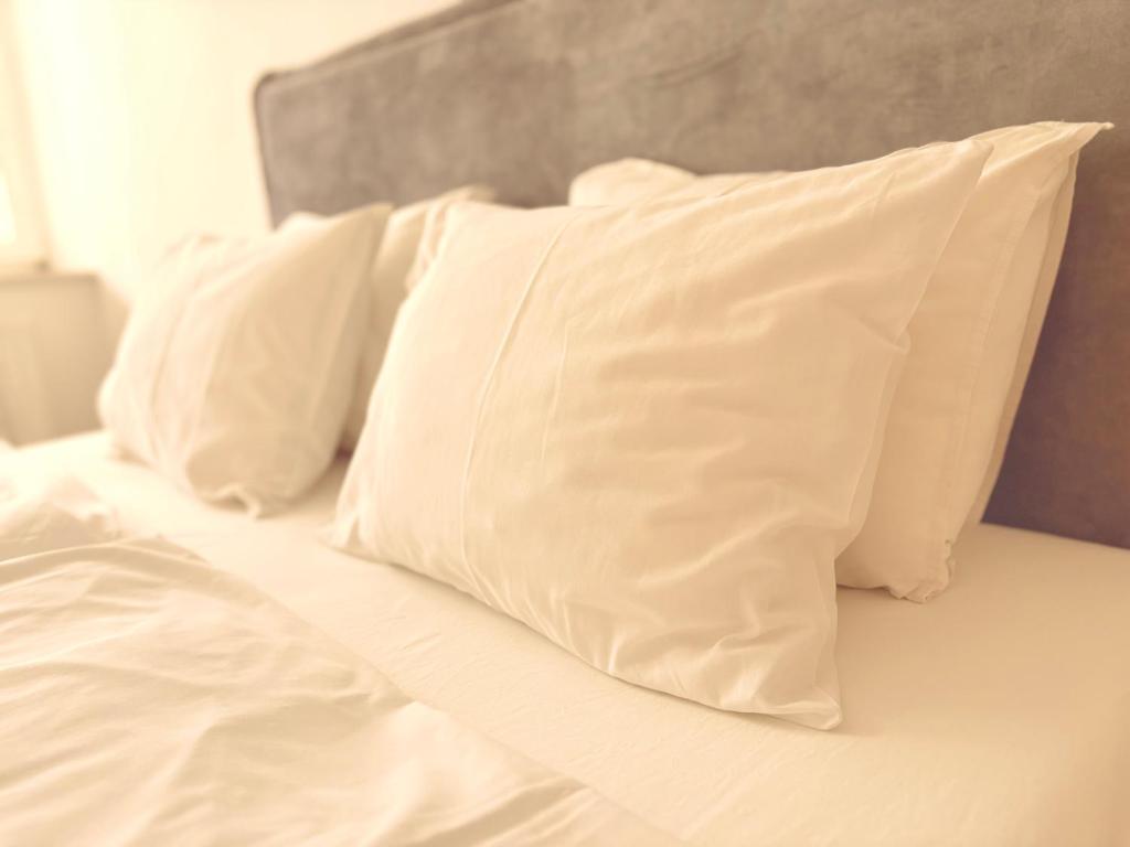 Posteľ alebo postele v izbe v ubytovaní Trio Apartments