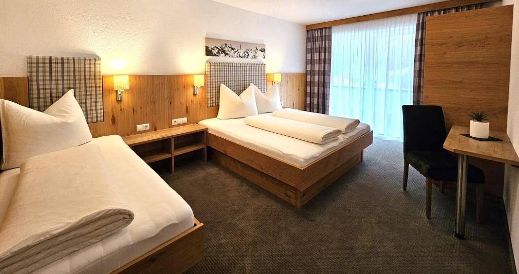 Una cama o camas en una habitación de Apart Stella Alpina