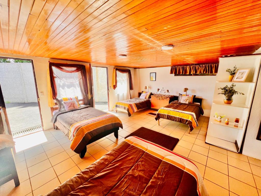 En eller flere senge i et værelse på Casa para grupos grandes 28 huéspedes