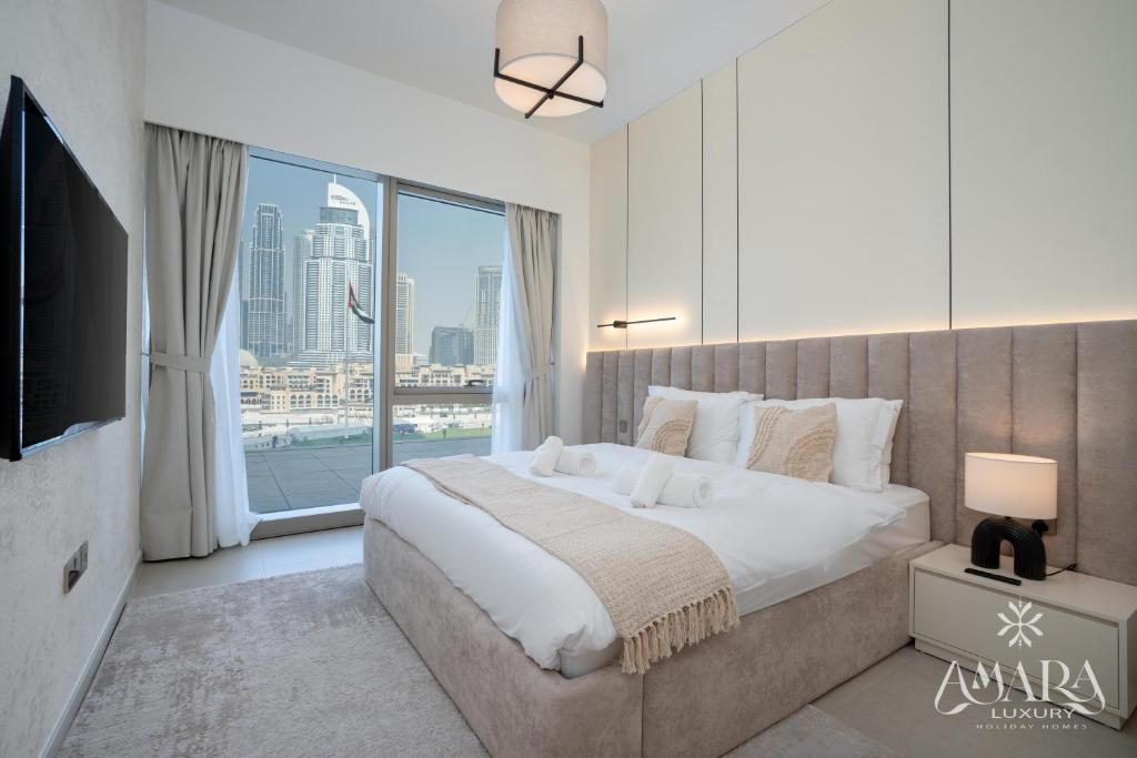 Ένα ή περισσότερα κρεβάτια σε δωμάτιο στο Grande Luxury, Burj Khalifa & Fountain View