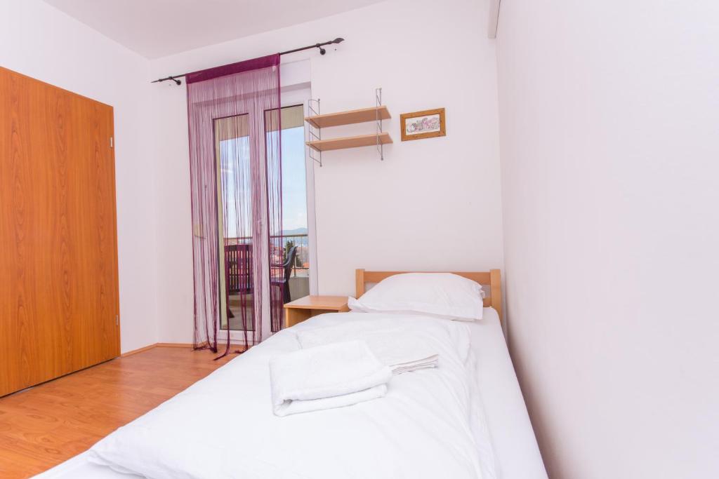 Posteľ alebo postele v izbe v ubytovaní Apartment Horizont