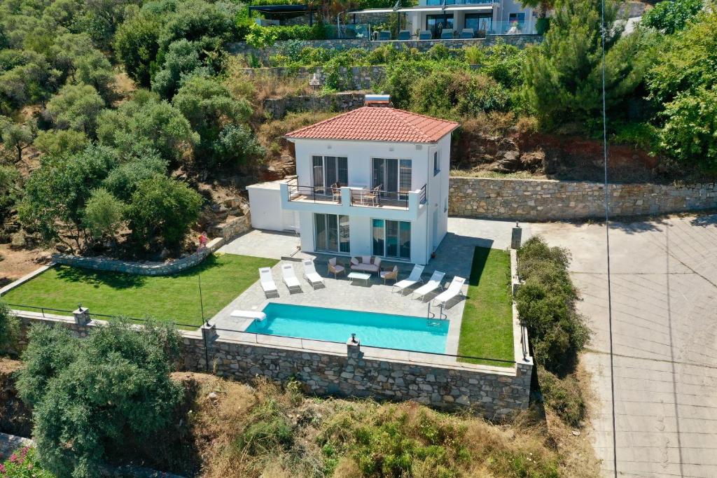 an aerial view of a house with a swimming pool at Beis Seaview Villa in Limenas