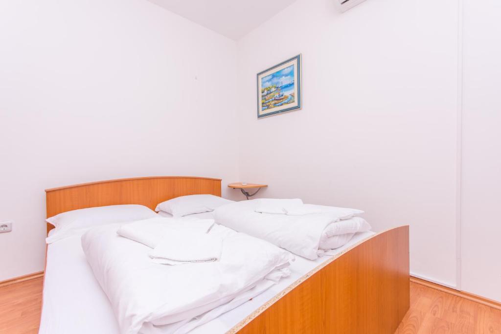 Posteľ alebo postele v izbe v ubytovaní Apartment Horizont