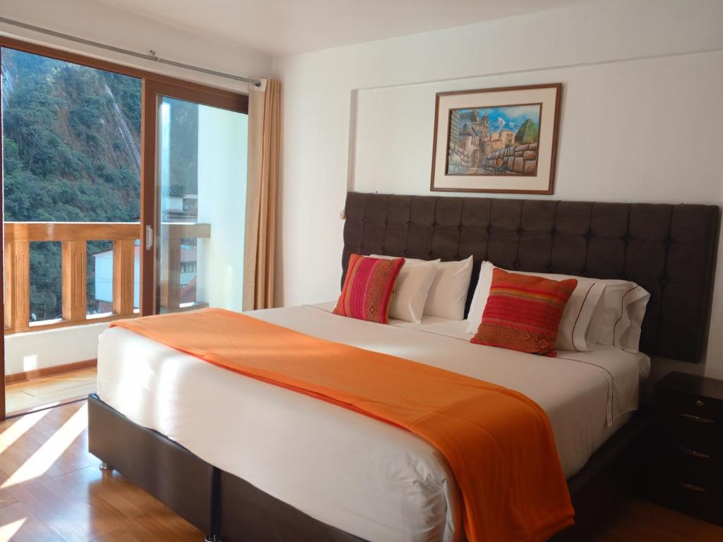 Postel nebo postele na pokoji v ubytování El Quetzal MachuPicchu