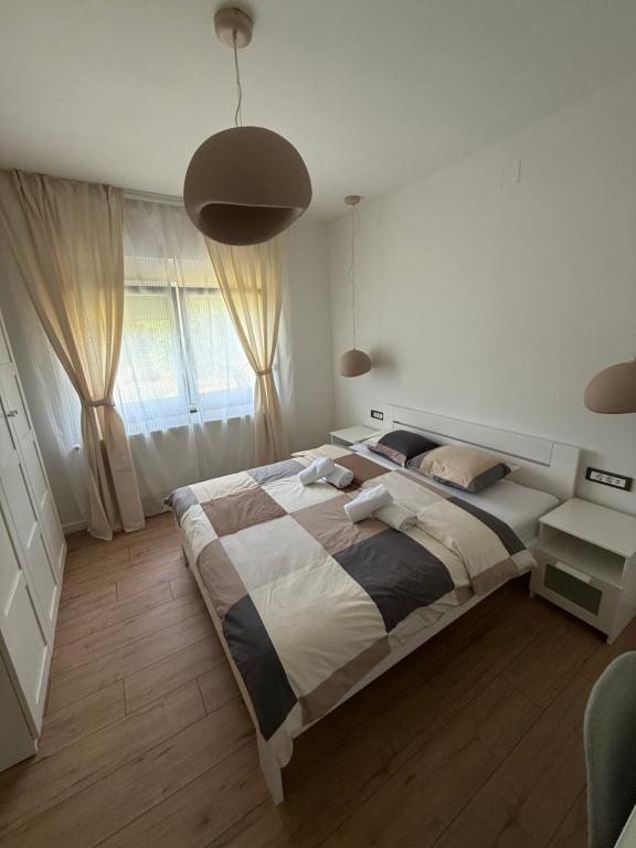 Postel nebo postele na pokoji v ubytování Cor Montis Apartments