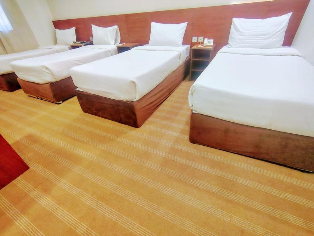 Postel nebo postele na pokoji v ubytování فندق روضة الششة قريب من محطة حافلات مجانية