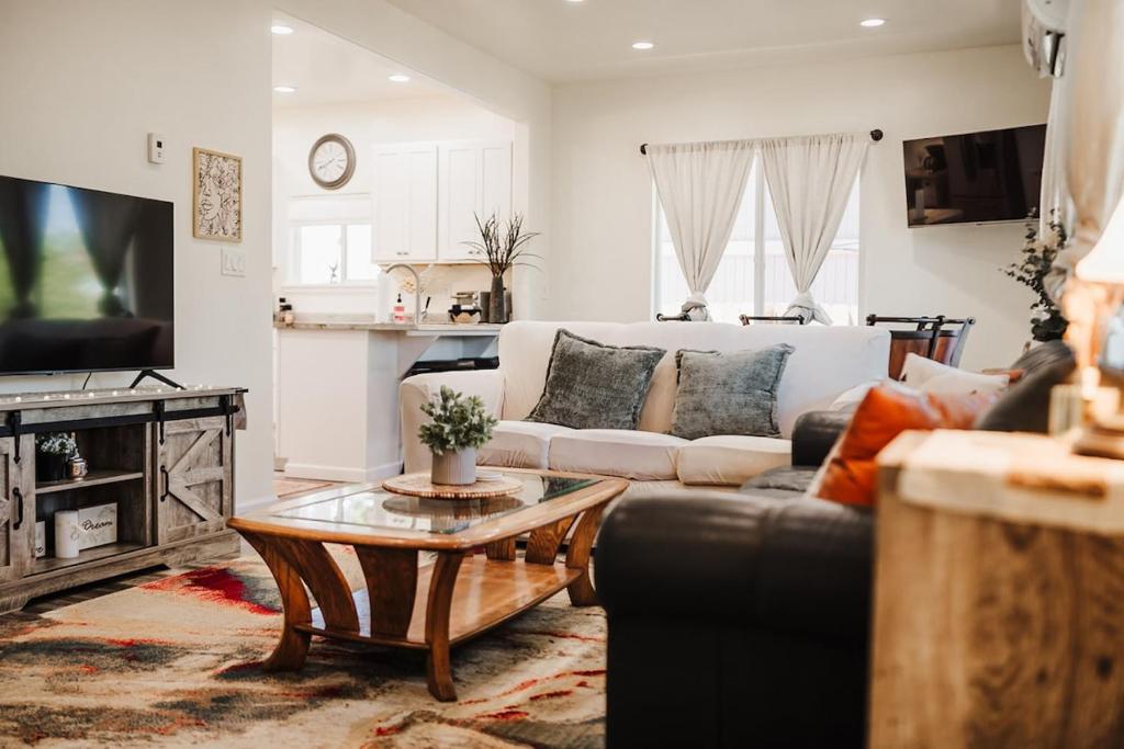a living room with a couch and a coffee table at The Berkeley House in Klamath Falls